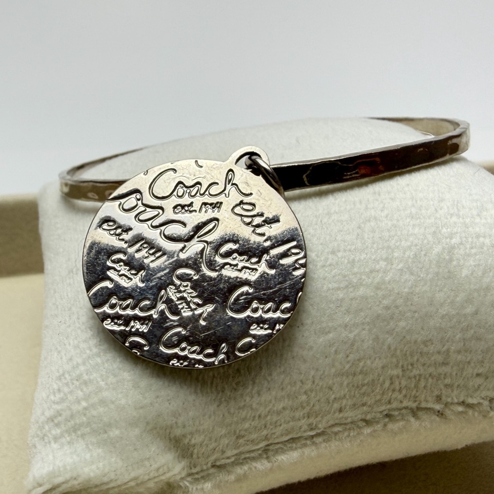 Chic Coach Silver Bangle With Circular Pendant - image 2